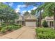 Inviting home with a brick and siding exterior, attached garage, and a well-kept front yard at 1608 Heritage Links Dr, Wake Forest, NC 27587