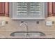 Close-up of a kitchen sink featuring stainless steel fixtures and granite countertops at 1608 Heritage Links Dr, Wake Forest, NC 27587