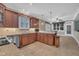Spacious kitchen featuring granite countertops, wooden cabinets, and tile flooring at 1608 Heritage Links Dr, Wake Forest, NC 27587