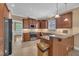 Well-equipped kitchen featuring stainless steel appliances, wood cabinetry, and a breakfast bar at 1608 Heritage Links Dr, Wake Forest, NC 27587