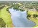 Scenic lake surrounded by the golf course and residential homes, offering a tranquil and picturesque setting at 1608 Heritage Links Dr, Wake Forest, NC 27587