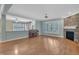 Spacious living room with hardwood floors, fireplace, and plenty of natural light at 1608 Heritage Links Dr, Wake Forest, NC 27587