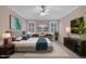 Beautiful staged bedroom with neutral decor, and comfortable, well-lit seating area at 1608 Heritage Links Dr, Wake Forest, NC 27587
