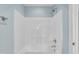 Shower with molded seat and chrome faucet, offering a clean and functional design at 1608 Heritage Links Dr, Wake Forest, NC 27587