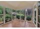 Bright sunroom with large windows, providing a tranquil space to enjoy the outdoors at 1608 Heritage Links Dr, Wake Forest, NC 27587