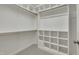 Spacious walk-in closet with multiple shelves and rods, offering ample storage space at 1608 Heritage Links Dr, Wake Forest, NC 27587