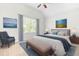 Stylish bedroom with a serene ambiance, featuring a comfortable bed, elegant decor, and ample natural light at 166 Daffodil Ln, Clayton, NC 27527