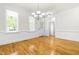 Dining area with hardwood floors, wainscoting, natural light and chandelier at 166 Daffodil Ln, Clayton, NC 27527