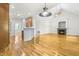 Open-concept living area flowing from kitchen with fireplace and vaulted ceilings at 166 Daffodil Ln, Clayton, NC 27527