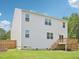 The rear of the home features multiple large windows to let in natural light at 170 Baker Farm Dr, Youngsville, NC 27596
