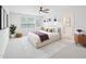 Beautifully decorated bedroom featuring a ceiling fan, neutral carpet and natural light at 170 Baker Farm Dr, Youngsville, NC 27596