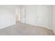 Bedroom with neutral carpeting; doorway leads to closet/bathroom at 170 Baker Farm Dr, Youngsville, NC 27596