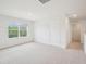 Bonus room with neutral carpet and natural light from the window at 170 Baker Farm Dr, Youngsville, NC 27596