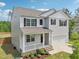 Charming two-story home with gray siding, a covered porch, and a two-car garage at 170 Baker Farm Dr, Youngsville, NC 27596