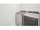 Washer and dryer in the laundry room with wire shelving for storage at 170 Baker Farm Dr, Youngsville, NC 27596