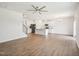 Open-concept living space with wood floors flowing into the kitchen with stainless steel appliances at 170 Baker Farm Dr, Youngsville, NC 27596