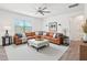 Comfortable living room features recessed lighting, ceiling fan and a plush sectional at 170 Baker Farm Dr, Youngsville, NC 27596