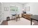 Bright office space featuring a large window and stylish decor at 170 Baker Farm Dr, Youngsville, NC 27596