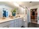 This bathroom offers a double vanity with a walk-in shower and tile surround plus a walk-in closet at 18 Relaxing Way, Pittsboro, NC 27312