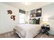 Bedroom with cozy carpet, a queen bed, a window, and charming decor at 18 Relaxing Way, Pittsboro, NC 27312