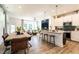 Open-concept living space with a modern kitchen, dining area, and comfortable living room at 18 Relaxing Way, Pittsboro, NC 27312