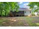 Expansive backyard featuring a screened porch and lush greenery, ideal for outdoor activities at 1870 Lennox Dr, Garner, NC 27529