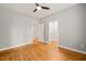 This bedroom features hardwood floors, two closets, and a ceiling fan at 1870 Lennox Dr, Garner, NC 27529