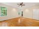 This bedroom features hardwood floors, recessed lighting, a ceiling fan, and a door to the outside at 1870 Lennox Dr, Garner, NC 27529