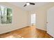 Bedroom features hardwood floors, large window, and a closet at 1870 Lennox Dr, Garner, NC 27529