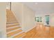 Entryway with hardwood floors and stairs leading to the upper level of the home at 1870 Lennox Dr, Garner, NC 27529
