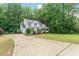 Inviting home with mature landscaping and a long driveway, providing a picturesque curb appeal at 1870 Lennox Dr, Garner, NC 27529