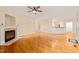 Open-concept living area with hardwood floors, fireplace, and seamless access to the kitchen at 1870 Lennox Dr, Garner, NC 27529