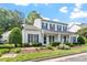 Charming two-story home with a welcoming front porch and beautifully landscaped front yard at 2010 Silky Dogwood Trl, Apex, NC 27502
