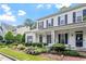 Beautiful home featuring blue shutters, a manicured lawn, and neatly trimmed shrubbery at 2010 Silky Dogwood Trl, Apex, NC 27502