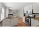Well-equipped kitchen featuring stainless steel appliances and granite countertops, seamlessly connected to the living space at 2010 Silky Dogwood Trl, Apex, NC 27502