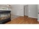 Hardwood floors compliment the fireplace and carpet in the living room at 2010 Silky Dogwood Trl, Apex, NC 27502