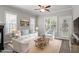 Cozy living room bathed in natural light, offering comfortable seating and a welcoming ambiance at 2010 Silky Dogwood Trl, Apex, NC 27502