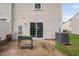 Backyard patio featuring sliding door access and central air conditioning unit at 2018 Grassy Banks Dr, Raleigh, NC 27610