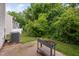 Backyard with lawn and mature trees offering privacy at 2018 Grassy Banks Dr, Raleigh, NC 27610