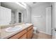 Bathroom featuring a double sink vanity with a large mirror and tiled floors at 2018 Grassy Banks Dr, Raleigh, NC 27610