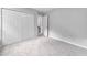 Spacious bedroom with carpet, neutral colors, a closet, and a window for natural lighting at 2018 Grassy Banks Dr, Raleigh, NC 27610