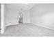 Carpeted bedroom with a view of the hallway, neutral colors, and natural lighting at 2018 Grassy Banks Dr, Raleigh, NC 27610