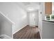 Foyer with hardwood flooring and a white front door at 2018 Grassy Banks Dr, Raleigh, NC 27610