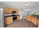 Open concept kitchen featuring stainless steel appliances and wood look flooring at 2018 Grassy Banks Dr, Raleigh, NC 27610