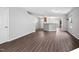 Spacious living room features an open layout with hardwood flooring and staircase to the upper level at 2018 Grassy Banks Dr, Raleigh, NC 27610