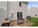 Back patio with sliding doors, an AC unit, and a garden planter at 2018 Grassy Banks Dr, Raleigh, NC 27610