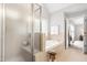 Bathroom with a shower, bathtub, tiled floors, and access to the main bedroom at 203 Witheridge Ct, Apex, NC 27502