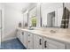Bathroom with dual sinks, vanity, and blue tile flooring at 203 Witheridge Ct, Apex, NC 27502