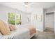 Bright bedroom with a window view, white furniture, and neutral carpet creating a serene space at 203 Witheridge Ct, Apex, NC 27502