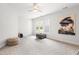 Bright bonus room featuring natural light, neutral walls and carpet and a ceiling fan at 203 Witheridge Ct, Apex, NC 27502